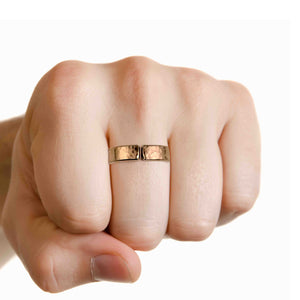 4 of 6: 5mm Hammered Bronze Cuff Ring on a finger against a white background