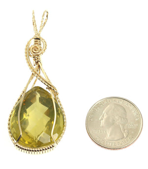 2 of 4: Size of 65 CT Green Gold Quartz 14K Gold-filled Pendant compared to a US Quarter Coin