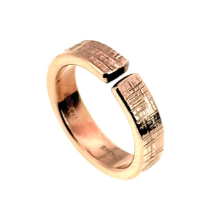 1 of 9: Side angled view of the 6mm linen bronze cuff ring on a white background, highlighting the open cuff gap, textured flat ends, polished bronze glow, smooth rounded shank, and handmade surface detail.