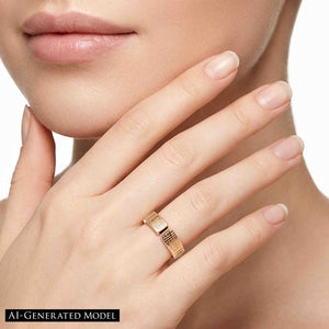 6 of 9: Close view of the 6mm linen bronze cuff ring worn on a woman’s finger, showing the open cuff shape, hand applied linen texture, polished bronze glow, and delicate modern styling.  AI Generated Model.