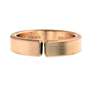7 of 10: Straight on view of a handmade 6mm matte bronze cuff ring on a white background, highlighting the narrow opening between the flat cuff ends and the softly brushed bronze finish.