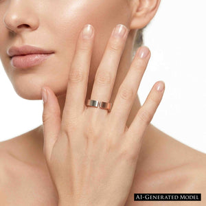 2 of 10: Close view of a woman wearing a handmade 6mm matte bronze cuff ring while resting her hand near her cheek, showing how the open band and brushed finish look on the finger against a clean white background.  AI Generated Model.