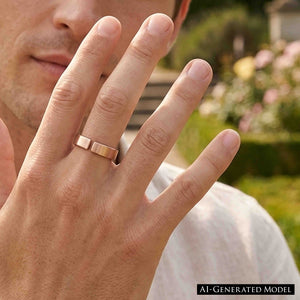 4 of 10: Close view of a man wearing a handmade 6mm matte bronze cuff ring outdoors, with his hand raised near his face and a softly blurred garden in the background.  AI Generated Model.