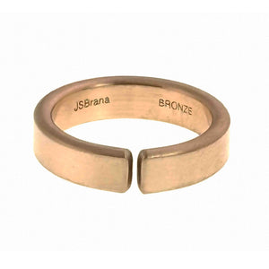 5 of 10: Front view of a handmade 6mm matte bronze cuff ring on a white background, showing the open band, softly brushed surface, rounded edges, and interior JSBrana and BRONZE stamps.