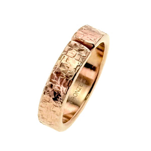 3 of 8: 6mm texturized bronze cuff ring with an open gap, hand-applied bark finish, warm golden bronze color, and polished inner band stamped BRONZE, shown at an angle on a clean white background.