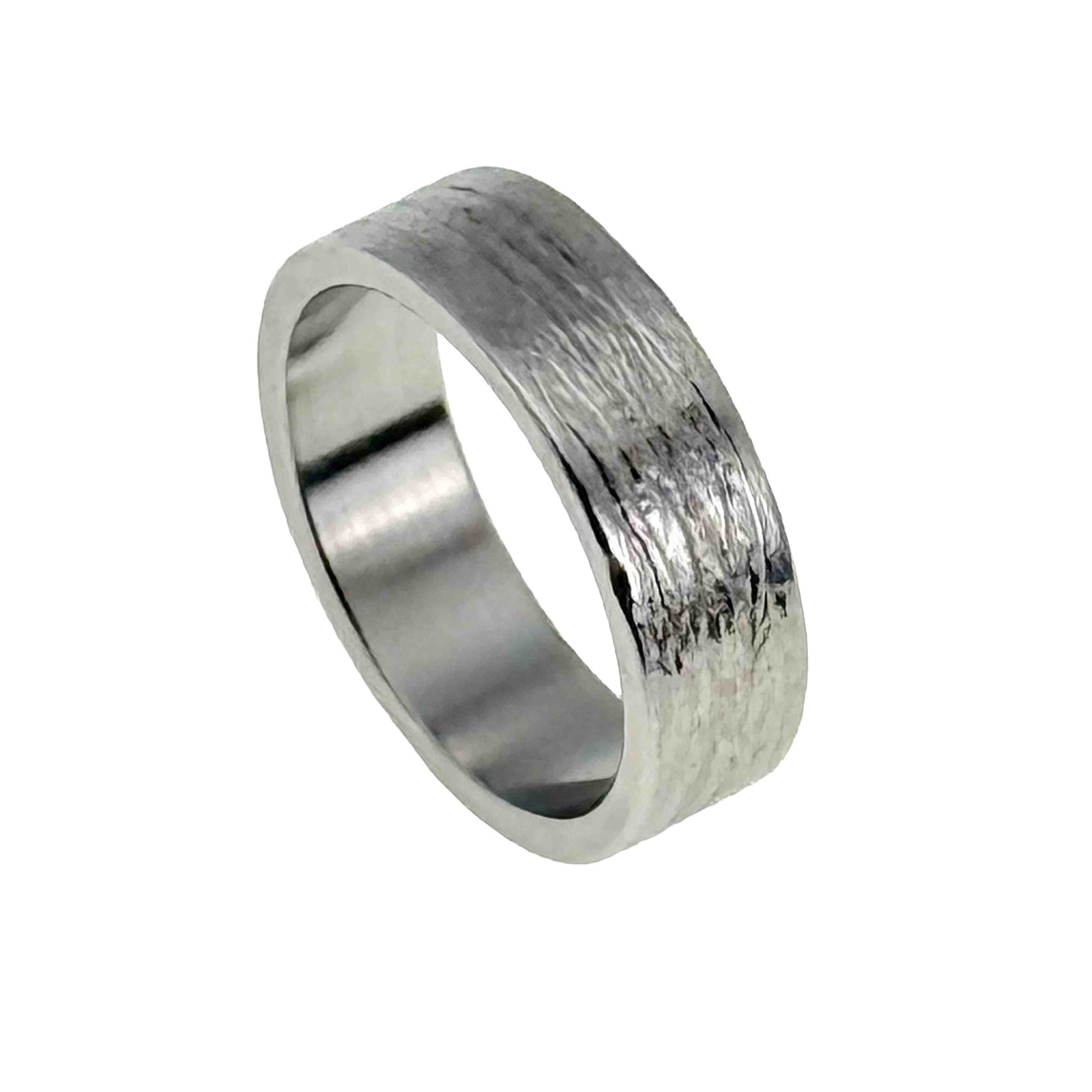 7mm wide stainless steel flat band ring featuring a hand carved bark texture on the exterior. The surface has an organic, tree bark inspired pattern with a polished finish that reflects light. Both the inner and outer edges are flat, giving the ring a clean, modern profile. The interior is smooth and shiny for comfortable everyday wear. Displayed at an angled view on a white background.