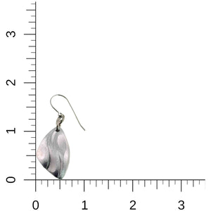 4 of 7: Aluminum flame petal dangle earring shown beside a ruler for size reference. The brushed silver tone aluminum drop features curved die struck detailing that resembles flowing petals or flames. The lightweight earring hangs from a stainless steel French ear wire and measures about 1.75 inches long and 0.75 inches wide, demonstrating its small to medium dangle size.