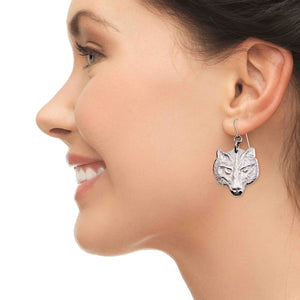 7 of 7: A Chic Woman Wearing Aluminum Wolf Head Earrings