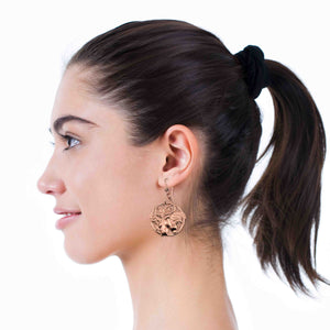 4 of 6: A Woman Smiling Wearing Art Nouveau Copper Lily Flower Disc Earrings