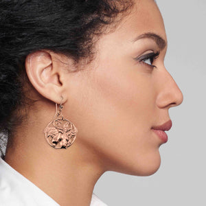 2 of 6: A Fashionable Woman Wearing Art Nouveau Copper Lily Flower Disc Earrings