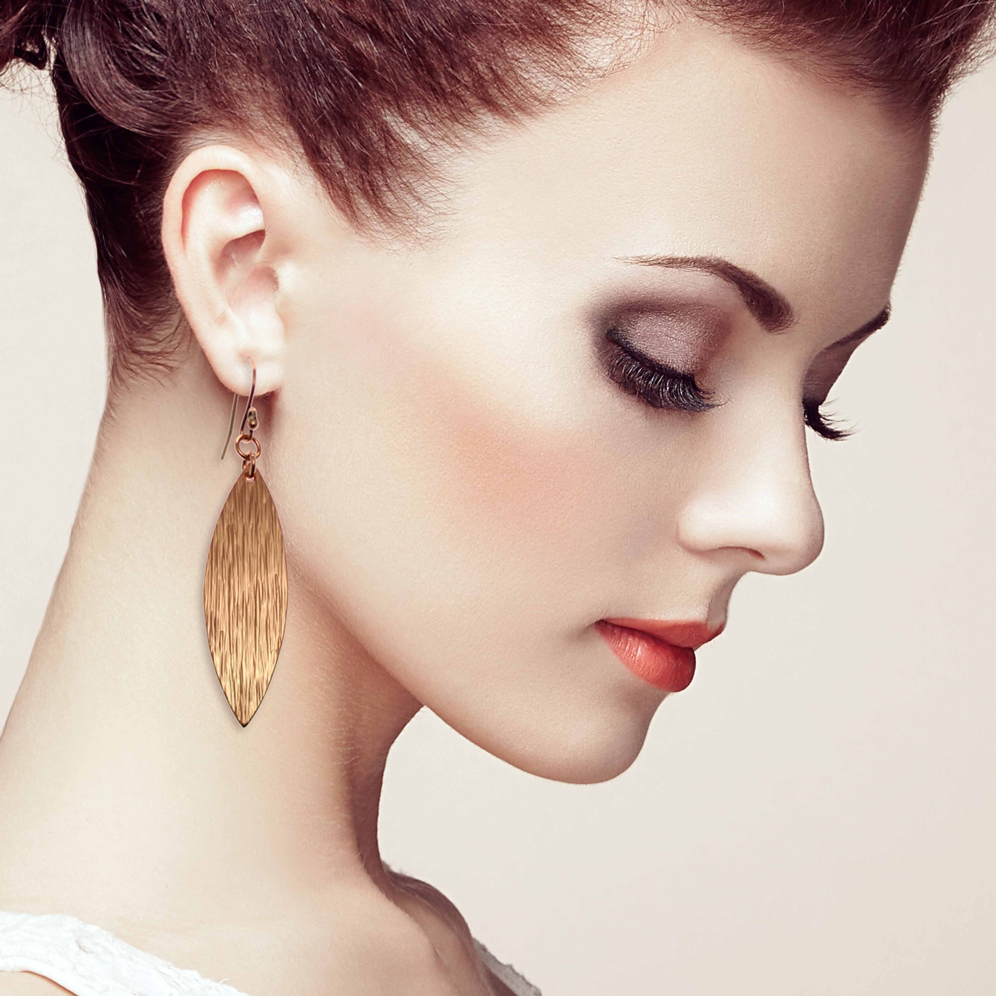 Stunning Woman With Red Hair Wearing Bark Embossed Copper Leaf Drop Earrings