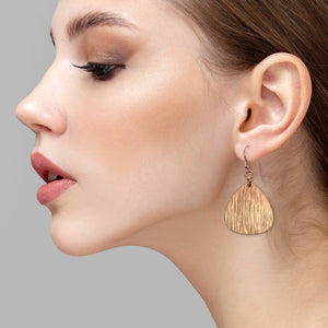 6 of 8: Elegant Woman Wearing Bark Embossed Copper Triangular Teardrop Earrings