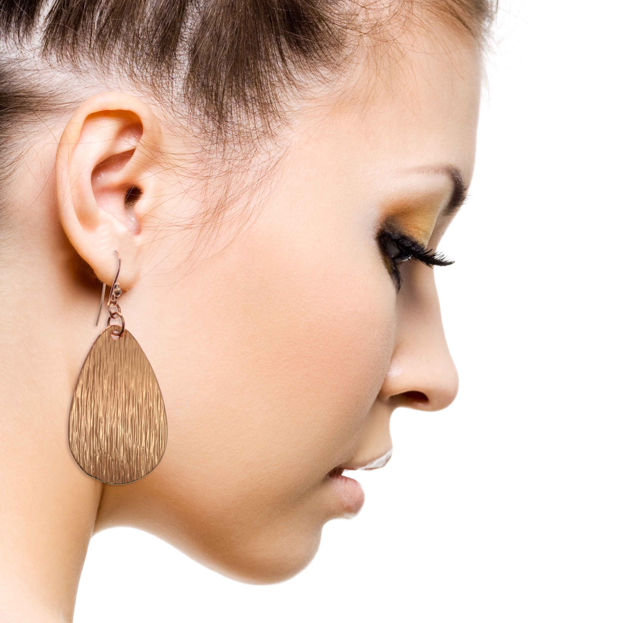 Stunning Woman Wearing Bark Embossed Large Teardrop Earrings