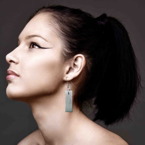 2 of 7: An Elegant Woman Wearing Aluminum Bark Dangle Earrings