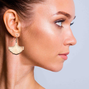 2 of 7: A Chic Woman Wearing Bronze Ginkgo Leaf Earrings