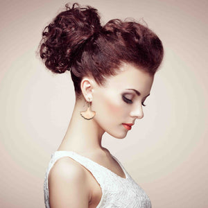 4 of 7: A Stunning Woman Wearing Bronze Ginkgo Leaf Earrings