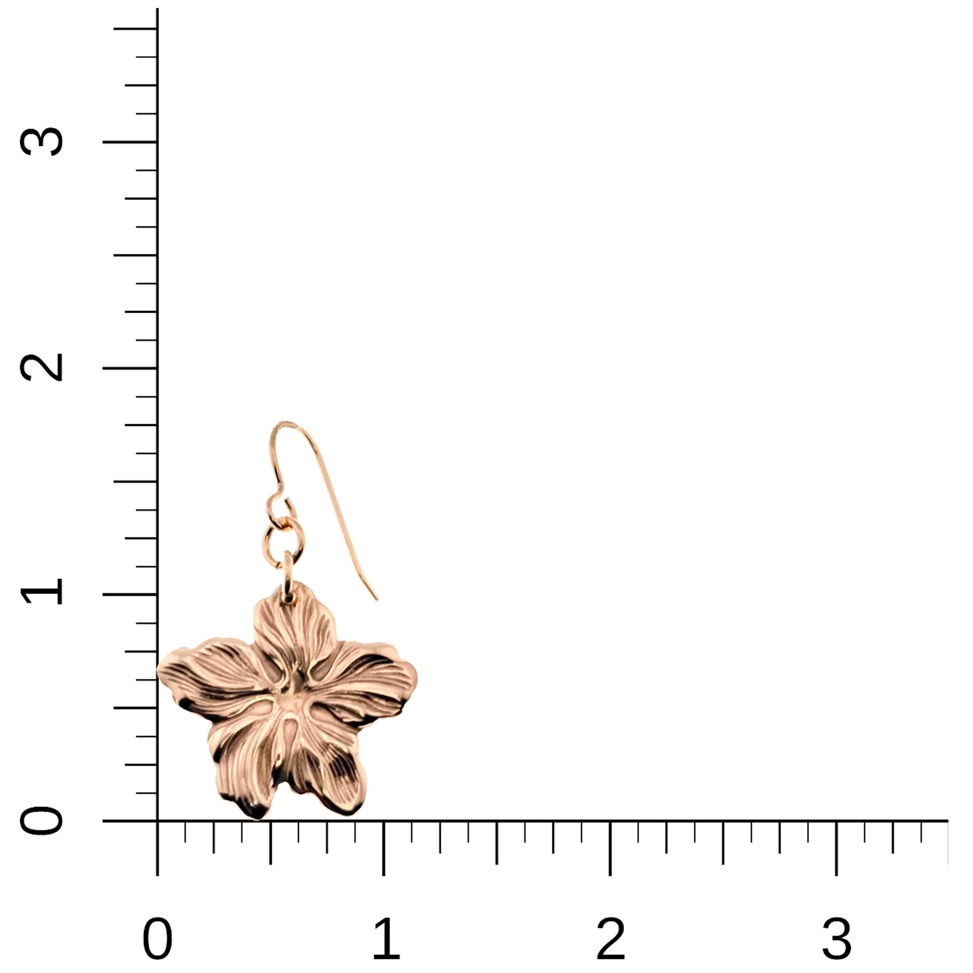 Bronze Hibiscus Flower Dangle Earring on a ruler for scale