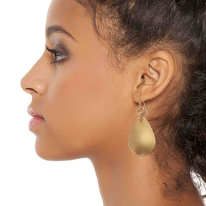 6 of 8: Chic Woman Wearing Brushed Bronze Medium Teardrop Earrings