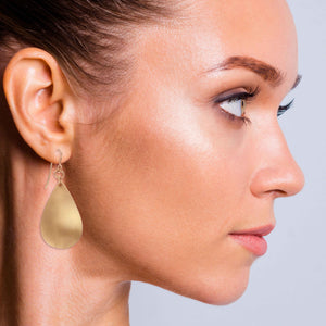 2 of 7: Elegant Woman Wearing Brushed Bronze Teardrop Earrings