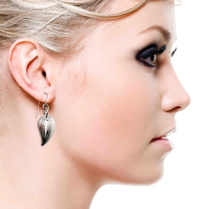 2 of 6: An Elegant Woman Wearing Chili Pepper Aluminum Drop Earrings 