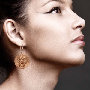 2 of 7: Elegant Woman Wearing Chinese Foo Dog Copper Disc Earrings