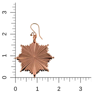 5 of 8: Christmas Starburst Copper Earring on a ruler for scale