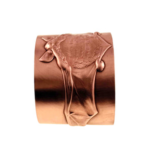 5 of 11: Front angled view of the Copper Bat Cuff Bracelet with the raised bat centered on the wide solid copper band. The brushed matte surface contrasts with the sculpted bat body, pointed ears, and long wing forms, highlighting the bold statement design against a white background.