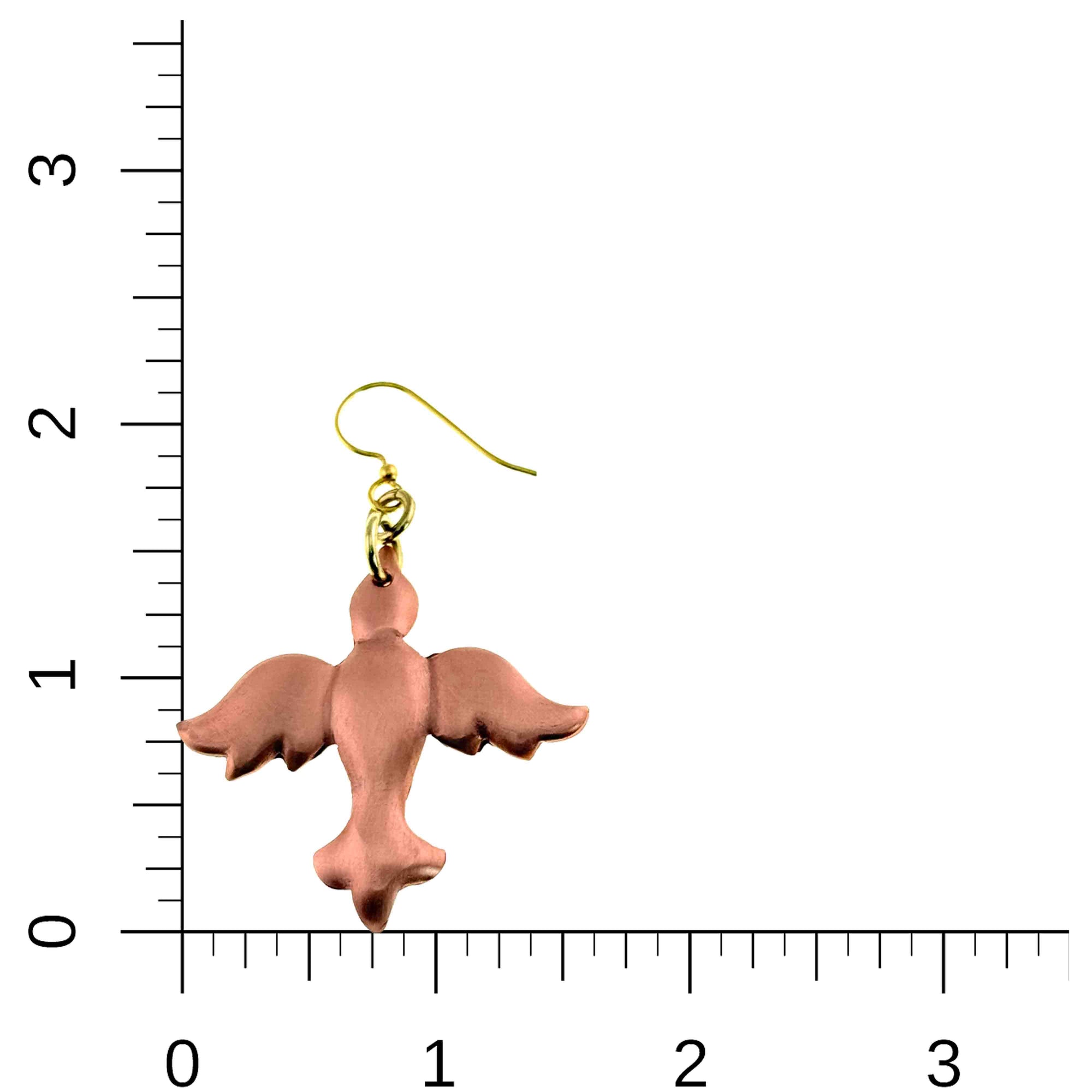 Copper Christmas Dove Dangle Earring on a ruler for scale