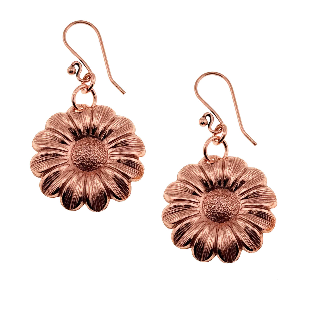 A Pair of Copper Daisy Disc Earrings on a White Background