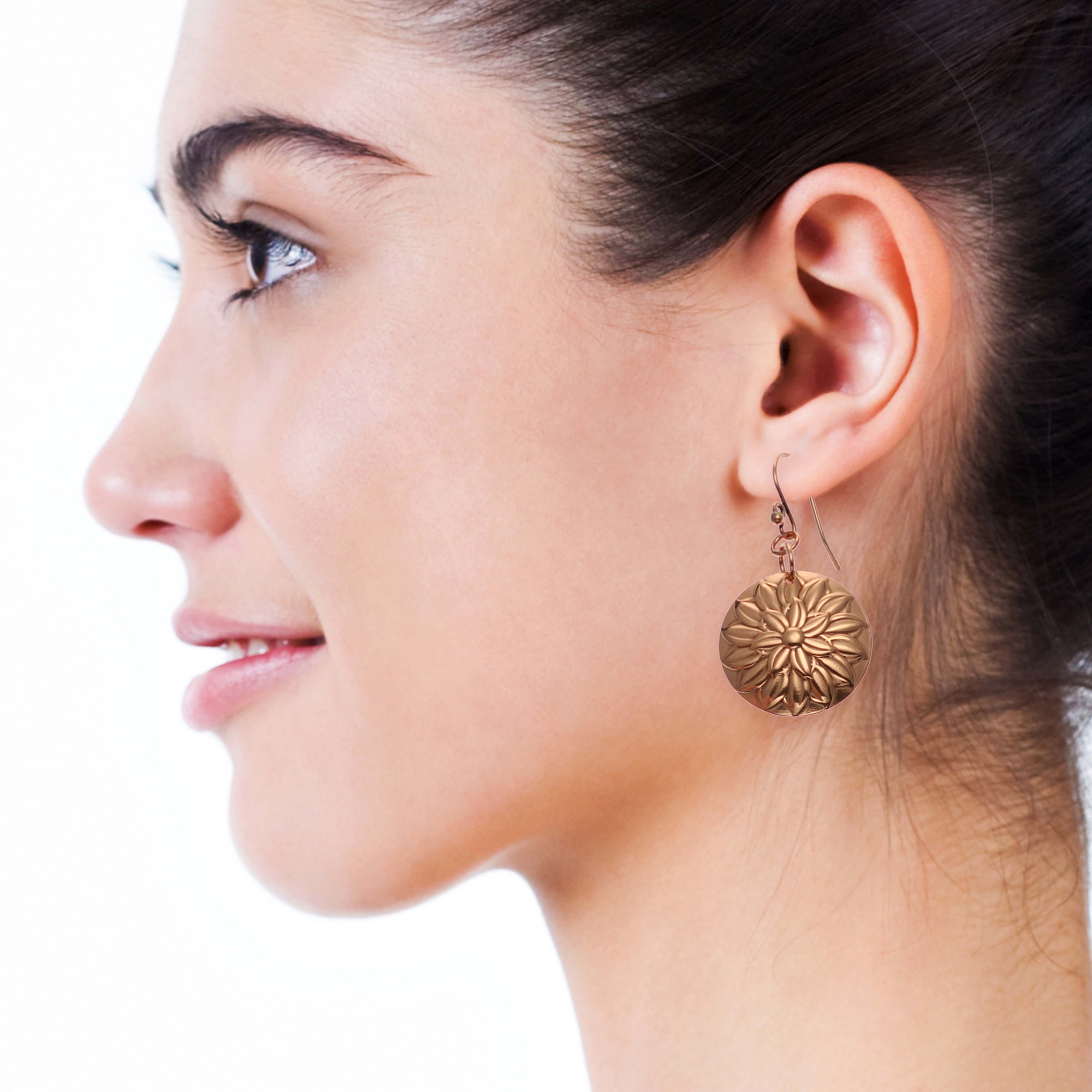 Smiling Woman Wearing Chrysanthemum Copper Disc Earrings
