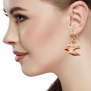 4 of 7: A Fashionable Woman Wearing Copper Flying Swallow Earrings