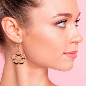2 of 7: A Stunning Woman Wearing Copper Forget Me Not Flower Earrings