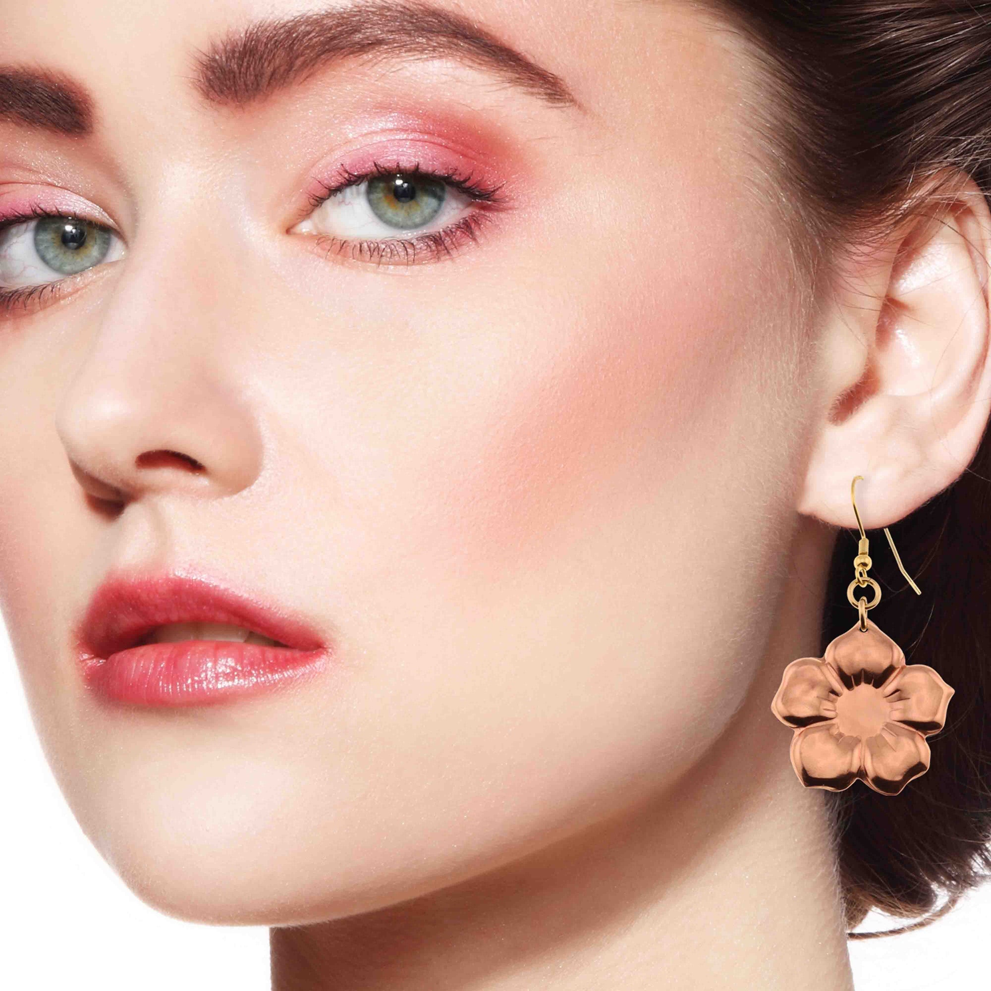 A Chic Woman Wearing Copper Forget Me Not Flower Earrings