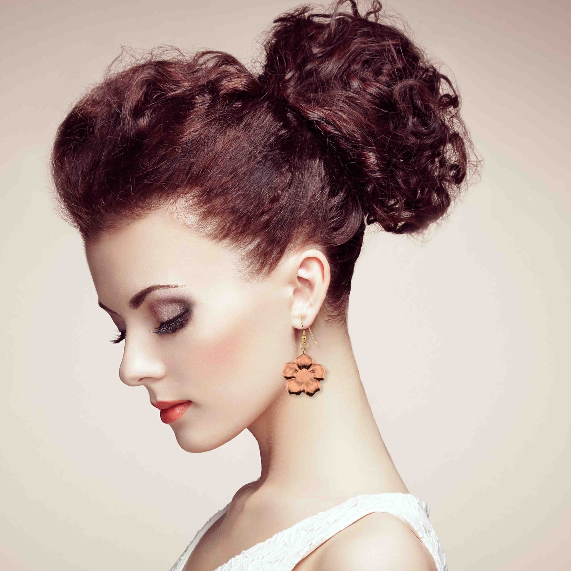 An Elegant Woman Wearing Copper Forget Me Not Flower Earrings