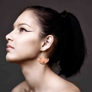 6 of 7: A Glamorous Woman Wearing Copper Ginkgo Leaf Earrings
