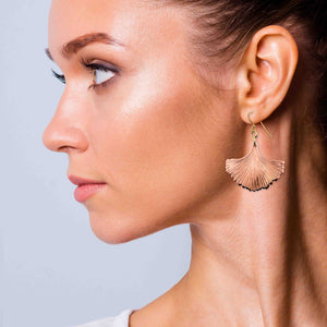 2 of 7: A Chic Woman Wearing Copper Ginkgo Leaf Earrings