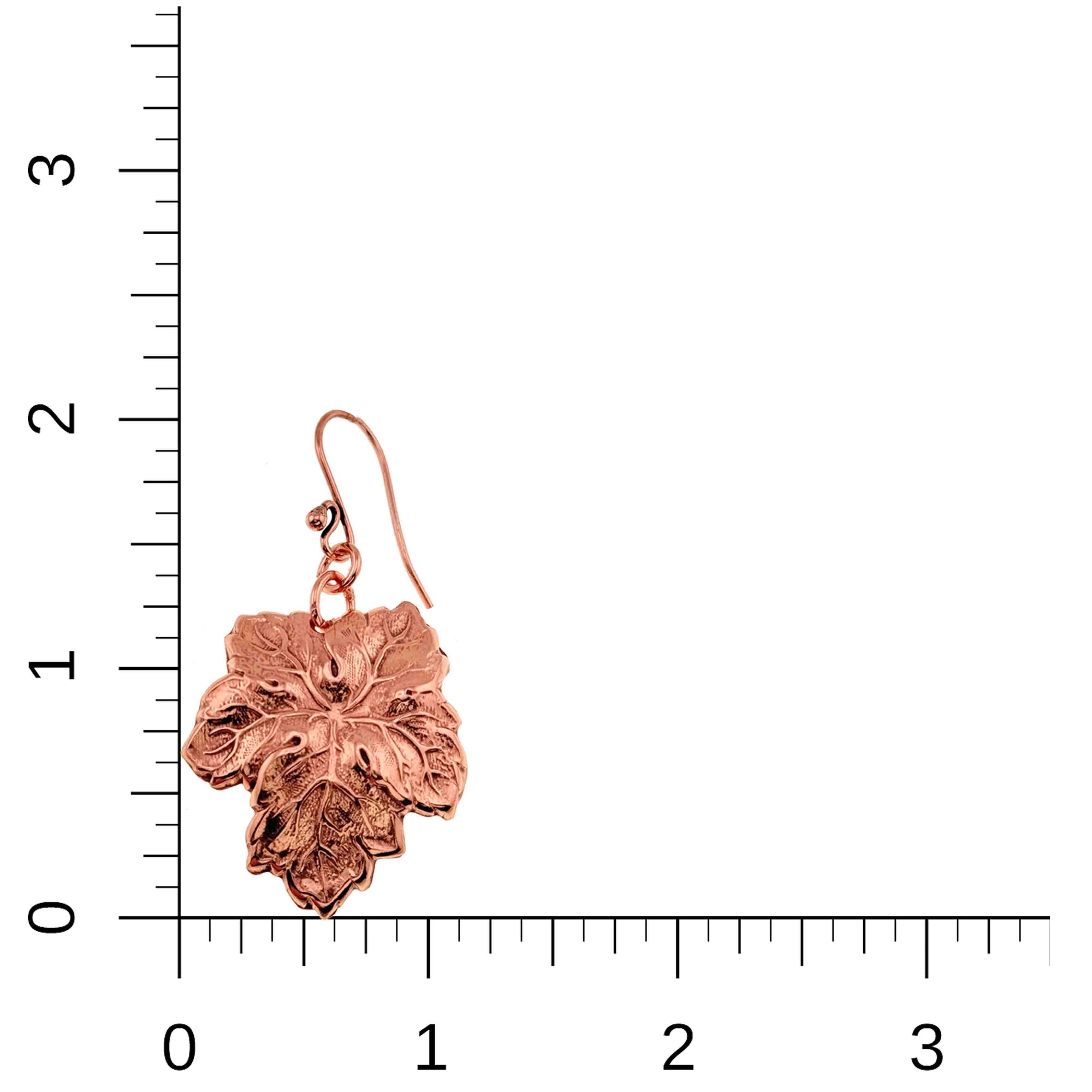 Grape Leaf Copper Dangle Earring on a ruler for scale