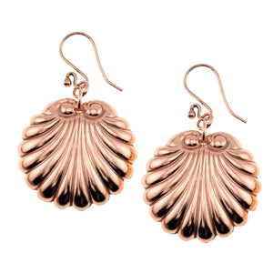 1 of 7: A Pair of Copper Scallop Shell Dangle Earrings on a White Background