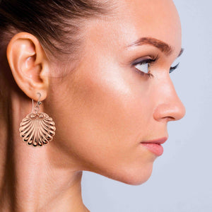 7 of 7: A Fashionable Woman Wearing Copper Scallop Shell Dangle Earrings