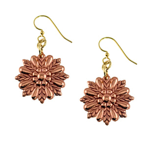 1 of 7: Copper sunburst flower dangle earrings with polished ornate floral detailing in a radiant sunburst shape. Raw copper flower charms hang from brass French ear wires, showing layered petal textures and a warm rose copper glow. Lightweight handcrafted earrings measuring about 1.75 inches long and 1 inch wide, photographed on a clean white background.