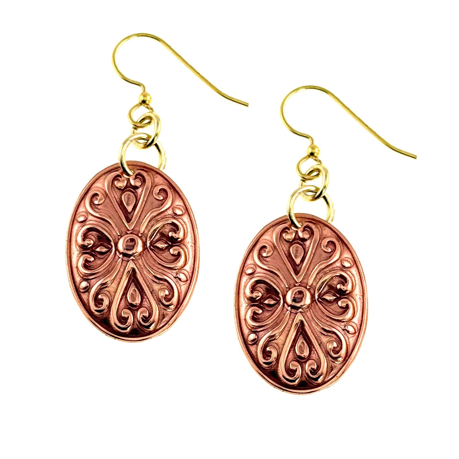 Handcrafted copper oval dangle earrings with polished Victorian scrollwork pattern, featuring warm reddish tones and brass French ear wires on a clean white background.