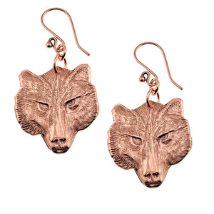 1 of 7: A Pair of Wolf Head Copper Drop Earrings on a White Background