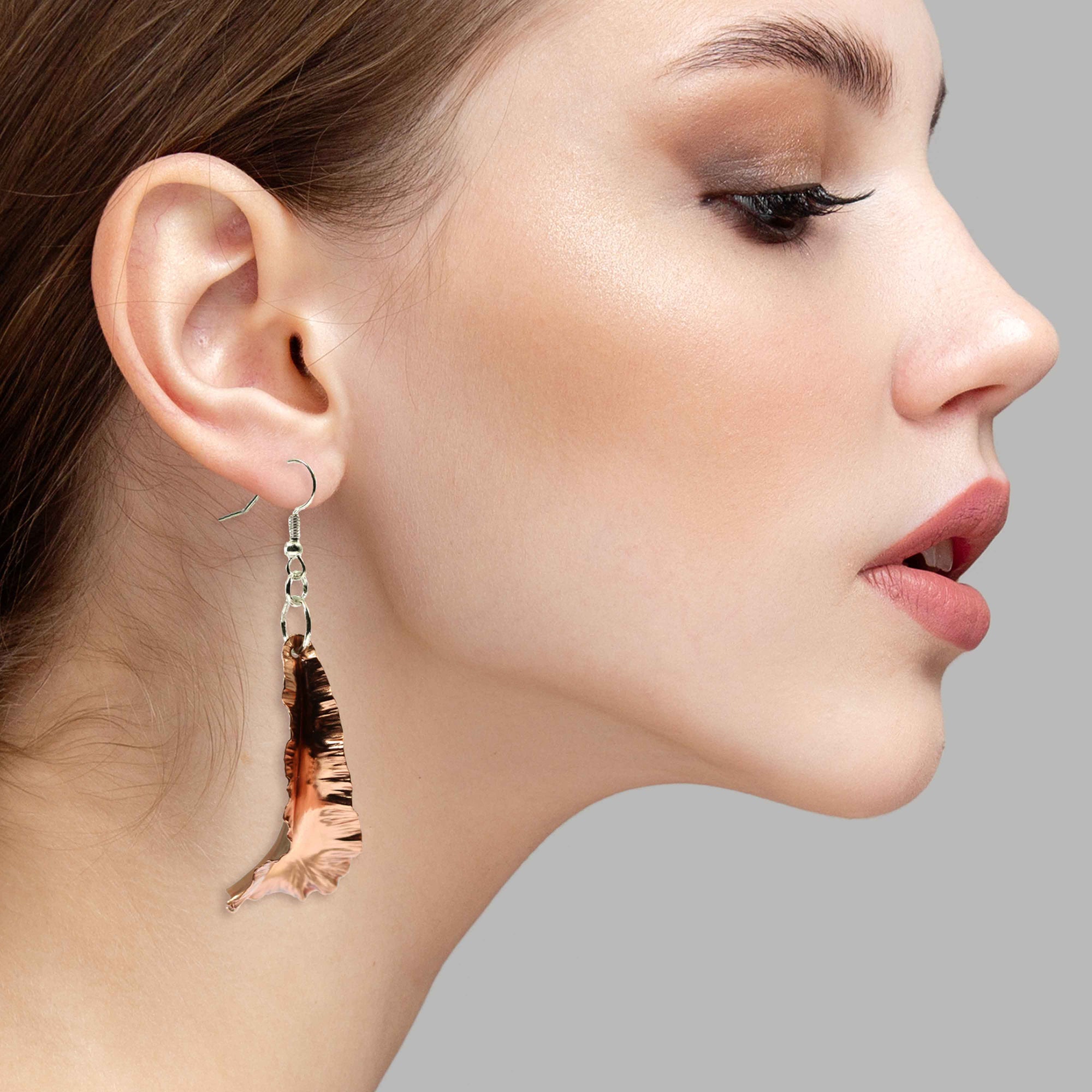 A Stunning Woman Wearing Copper Fold Formed Leaf Dangle Earrings