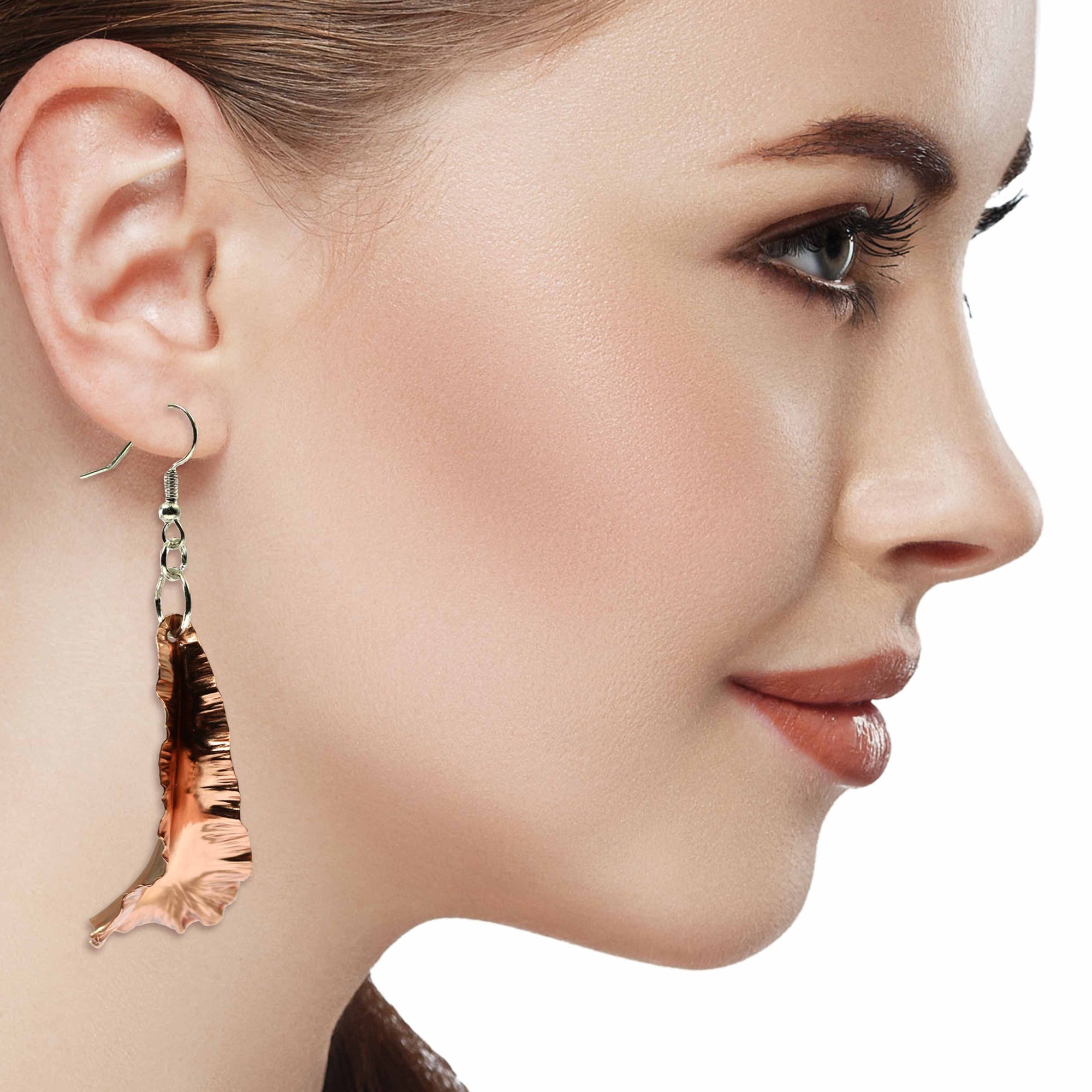 A Chic Woman Wearing Copper Fold Formed Leaf Dangle Earrings