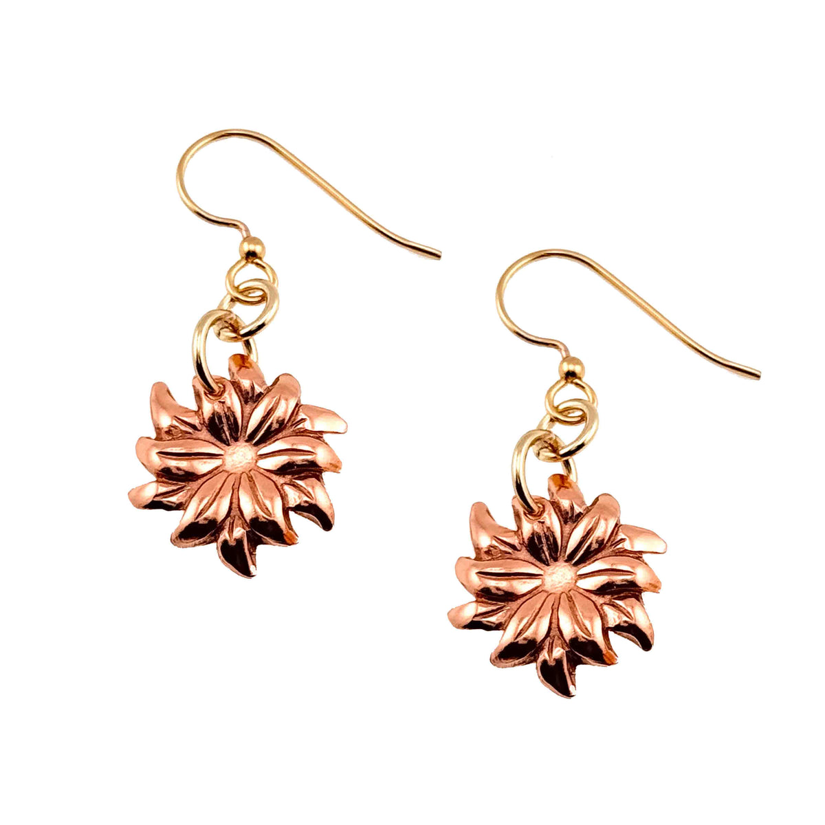 A Pair of Dainty Copper Dahlia Dangle Earrings on a White Background