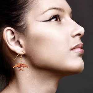 6 of 6: A Glamorous Woman Wearing Dainty Copper Swallow Earrings