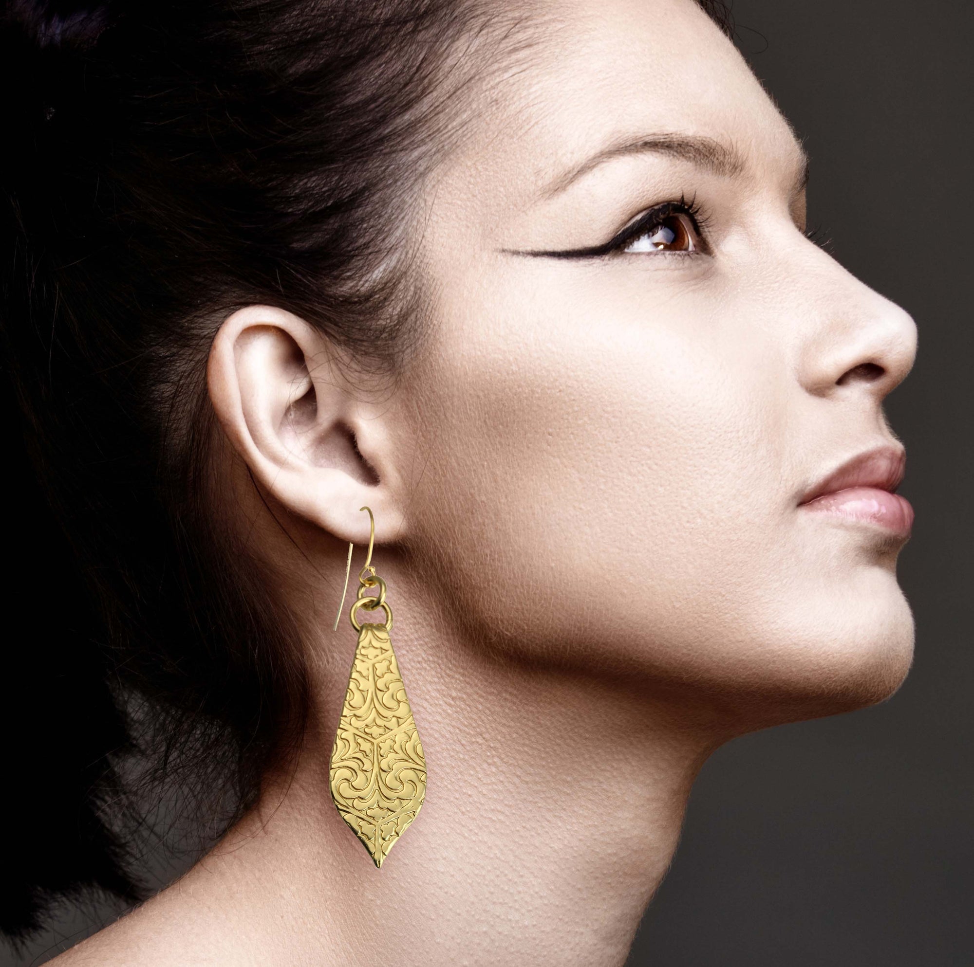 Elegant Female Model Wearing Damask Embossed Brass Nu Gold Marrakesh Teardrop Earrings