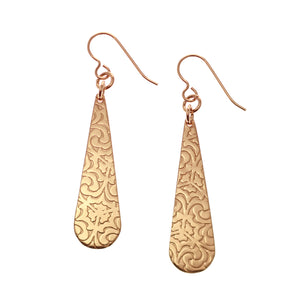 1 of 7: A Pair of Damask Embossed Bronze Long Teardrop Earrings on a White Background