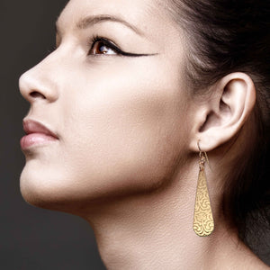 2 of 7: Elegant Woman Wearing Damask Embossed Bronze Long Teardrop Earrings