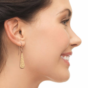 2 of 7: Smiling Woman Wearing Damask Embossed Mini Bronze Teardrop Earrings